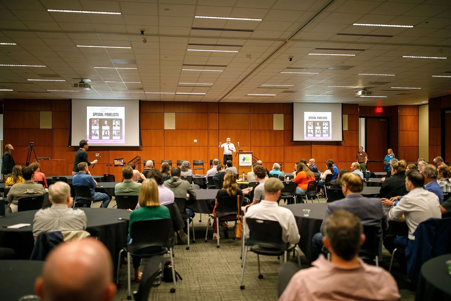 Chris Kovac speaking to a full room