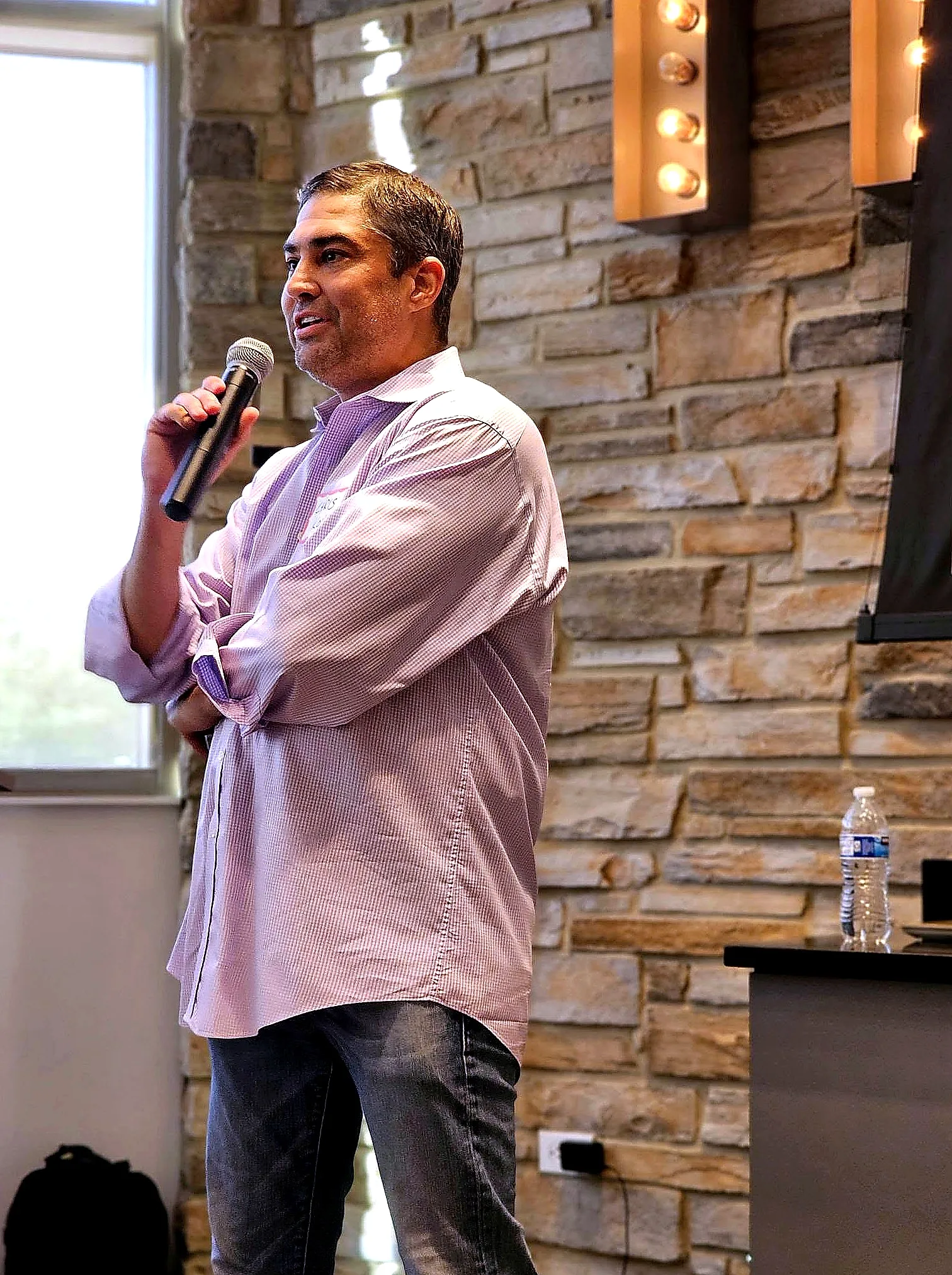 Chris Kovac speaking with a microphone